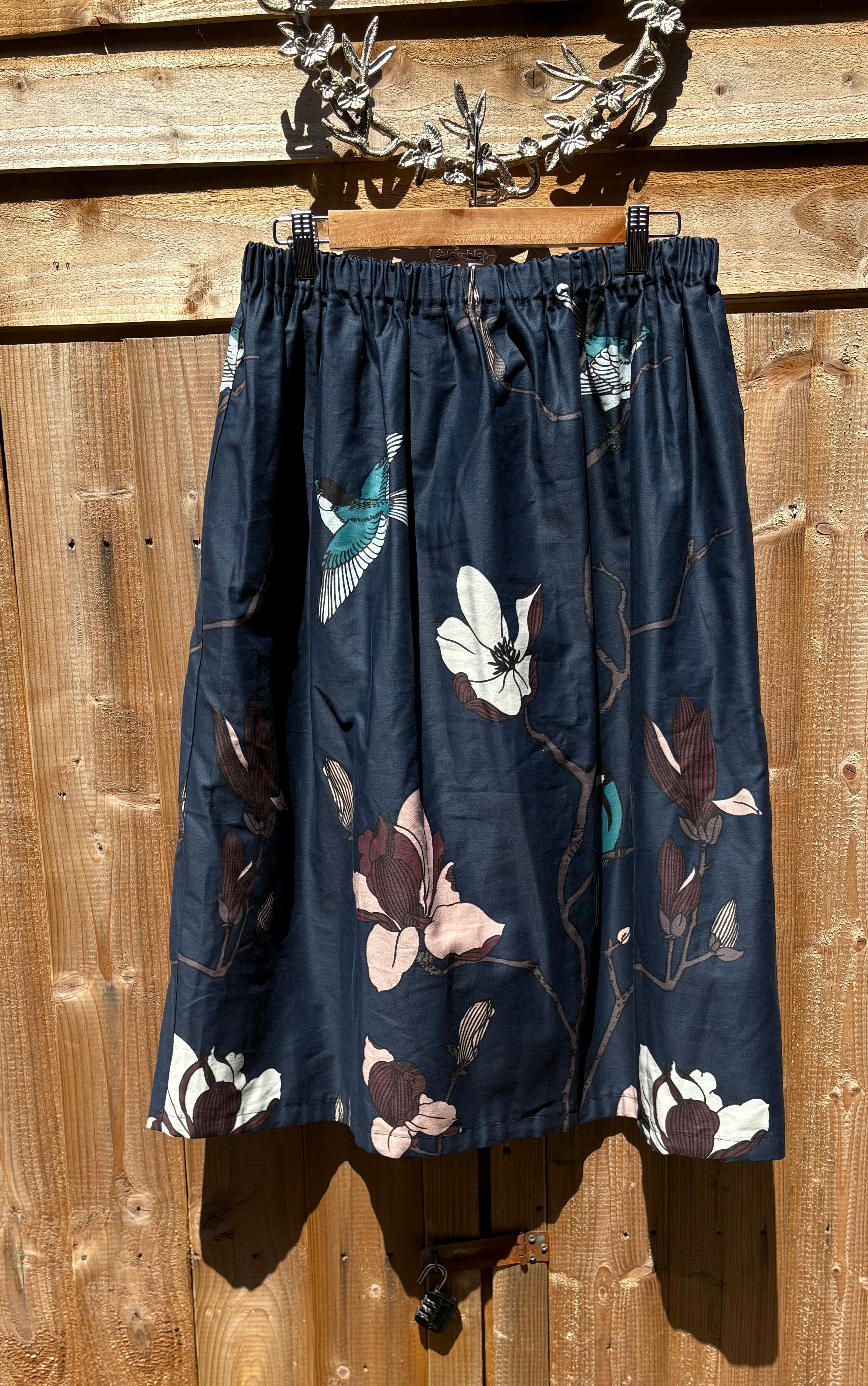 Handmade Ruth skirt in blue with white birds with elasticated wait to fit up to 31ins waist